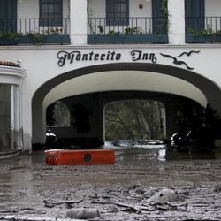 Debris and mud cover the entrance of the Montecito Inn after heavy rain brought flash flooding and mudslides to the area in Montecito, Calif. on Tuesday, Jan. 9, 2018. At least five people were killed and homes were swept from their foundations Tuesday as heavy rain sent mud and boulders sliding down hills stripped of vegetation by a gigantic wildfire that raged in Southern California last month. (Daniel Dreifuss)