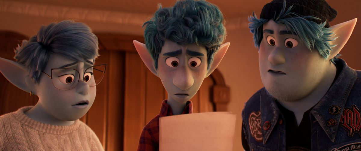 Blue elves Barley, Ian, and their mother all gape at a written message Ian is holding in Pixar’s Onward.