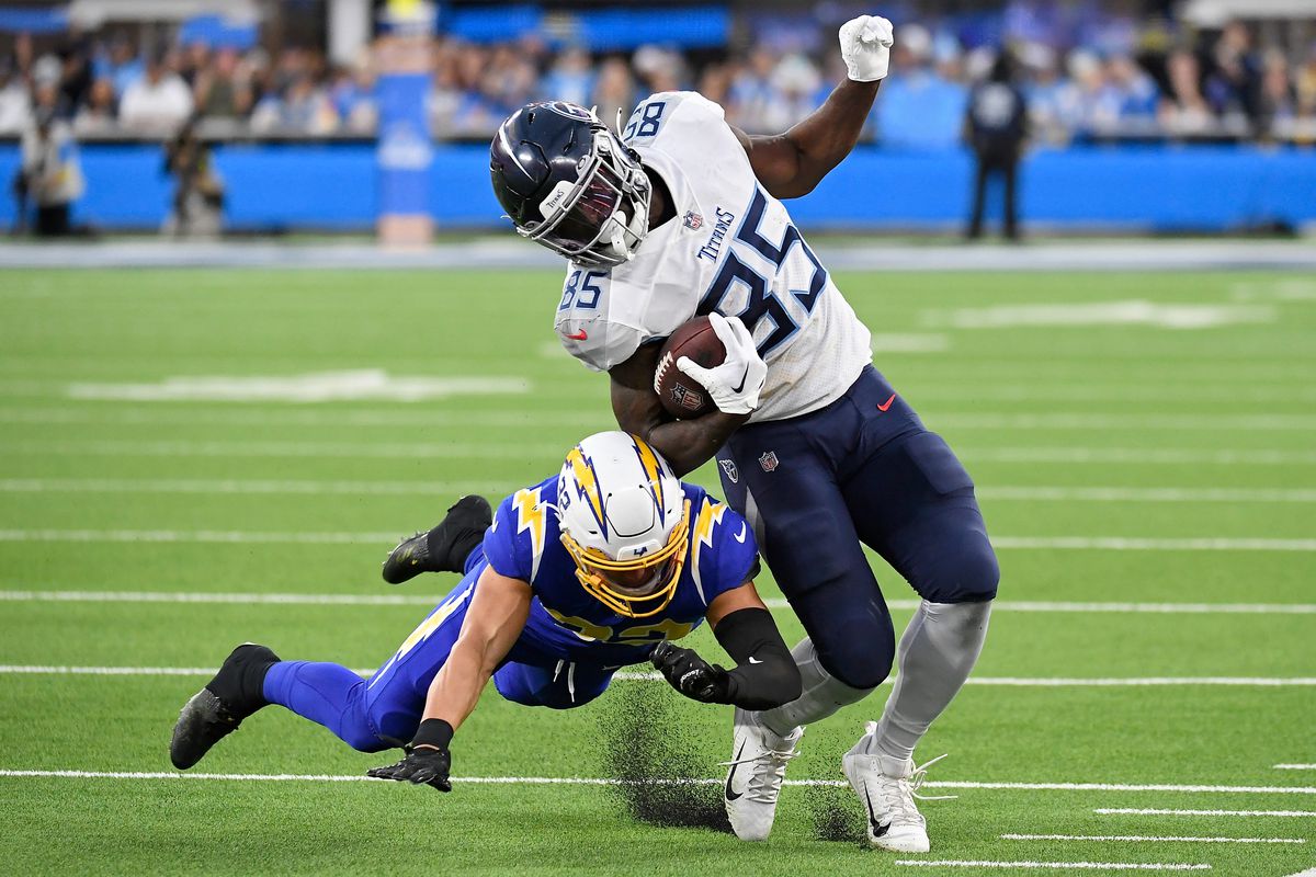 Chigoziem Okonkwo #85 of the Tennessee Titans runs with the ball during the fourth quarter of the game against the Los Angeles Chargers at SoFi Stadium on December 18, 2022 in Inglewood, California.