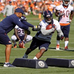 On day one of Training Camp, Kapri Bibbs works through the small gap and arm swats from RB Coach Eric Studesville.