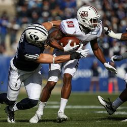 Brigham Young Cougars linebacker Sae Tautu (31) tackles UMass Minutemen wide receiver Jalen Williams (80) during a game at LaVell Edwards Stadium in Provo on Saturday, Nov. 19, 2016.