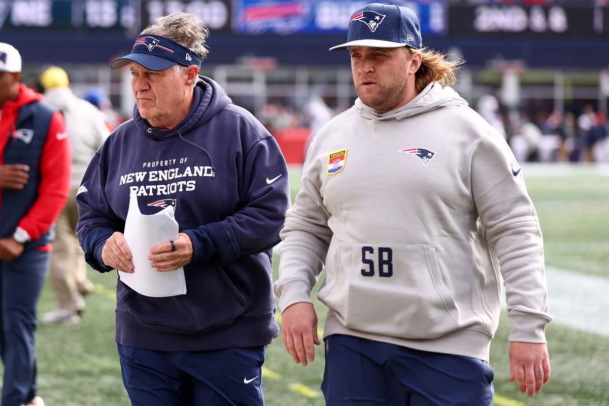 Head coach Bill Belichick of the New England Patriots and linebackers coach Steve Belichick walk together during the game against the Buffalo Bills at Gillette Stadium on October 22, 2023 in Foxborough, Massachusetts.