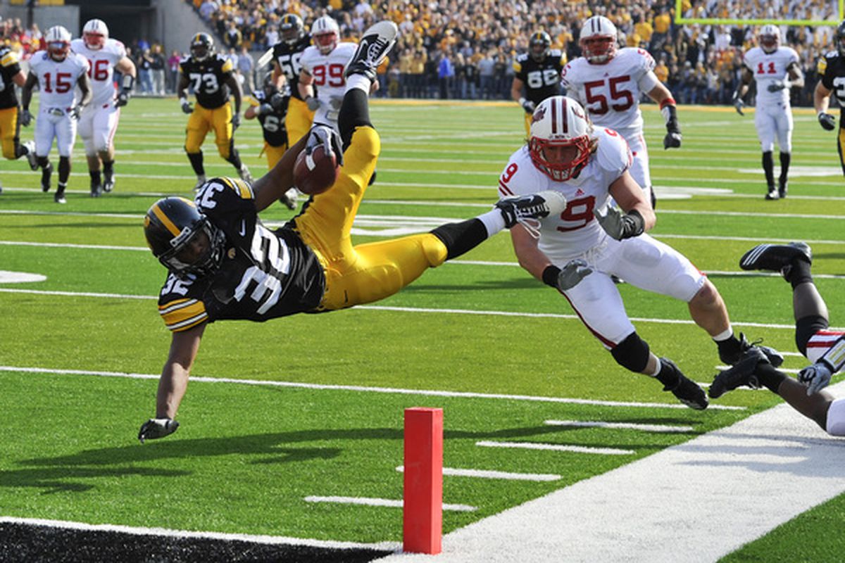 IOWA CITY IA - OCTOBER 23: Former Iowa RB Adam Robinson leaps for the endzone, before AIRBHG introduces him to weed. (Photo by David Purdy/Getty Images).