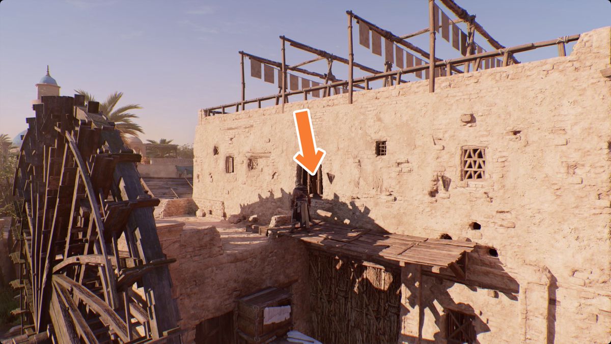 Assassin’s Creed Mirage Basim on a ledge behind a waterwheel