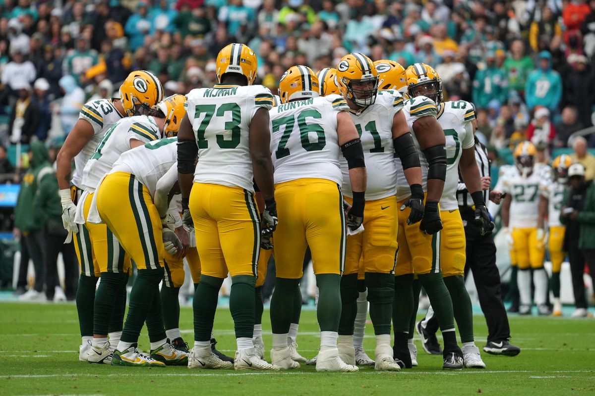 The Green Bay Packers huddle before a play during the game between the Green Bay Packers and the Miami Dolphins on Sunday, December 25, 2022 at Hard Rock Stadium, Miami Gardens, Fla.