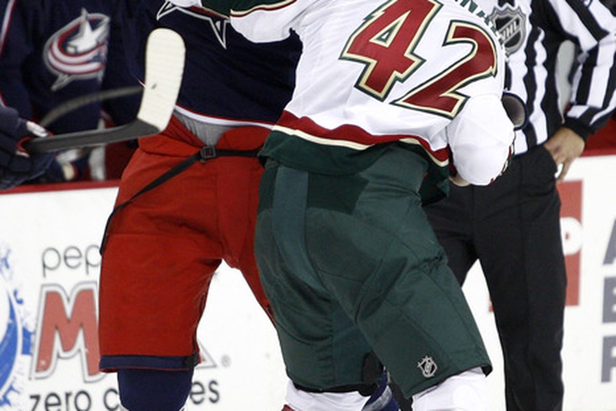 COLUMBUS,OH - SEPTEMBER 28:  Tom Sestito #23 of the Columbus Blue Jackets fights with Drew Bagnall #42 of the Minnesota Wild during the first period on September 28 2010 at Nationwide Arena in Columbus Ohio.  (Photo by John Grieshop/Getty Images)