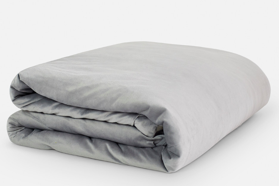 Folded up gray bedding.