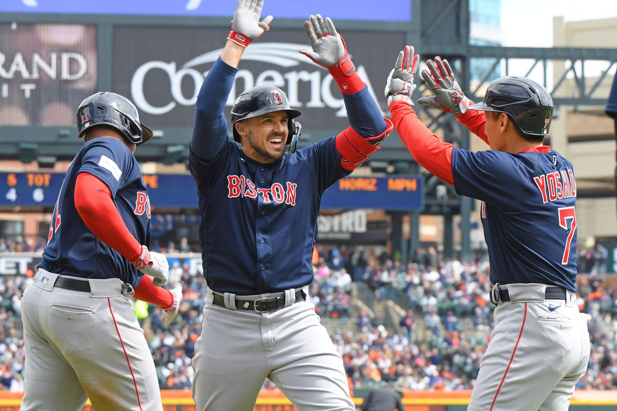 Adam Duvall #18 (center) of the Boston Red Sox is greeted at home plate by teammates Rafael Devers #11 and Masataka Yoshida #7 after he hit a 3-run home run in the 6th inning of the Opening Day game against the Detroit Tigers at Comerica Park on April 6, 2023 in Detroit, Michigan. The Red Sox defeated the Tigers 6-3.