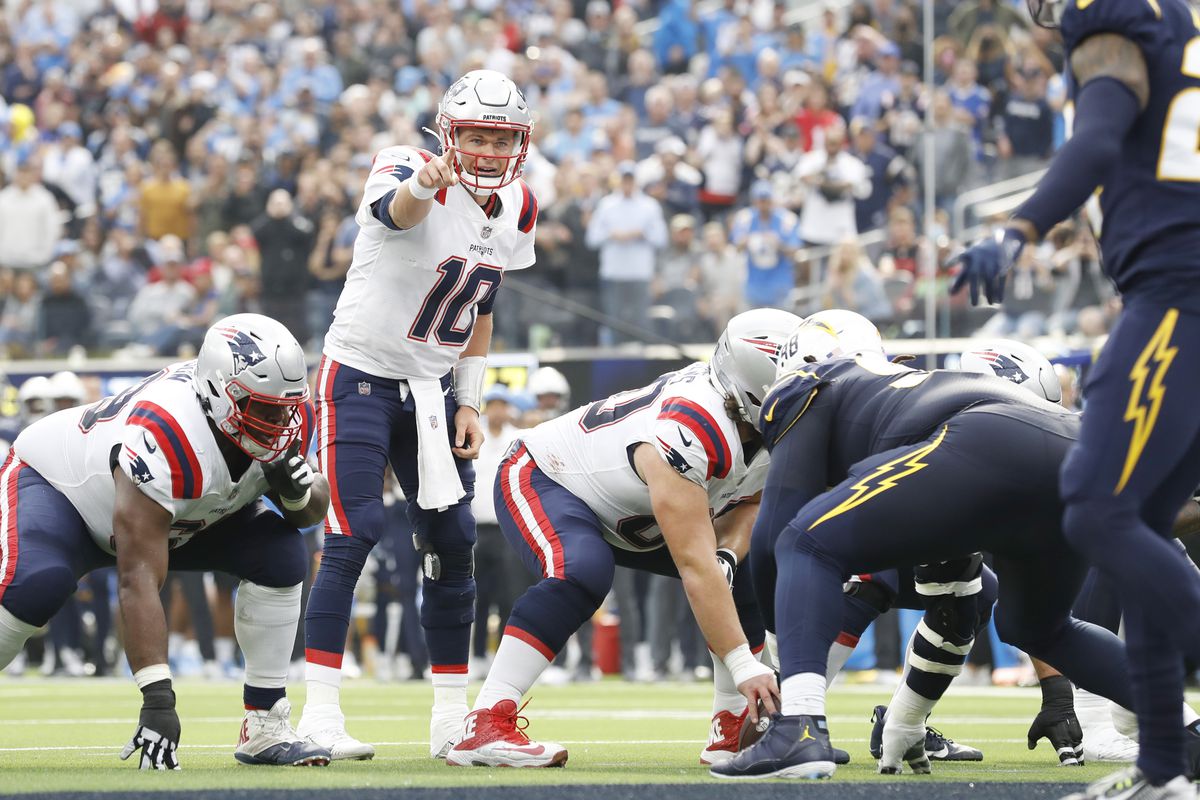 Mac Jones #10 of the New England Patriots calls out instructions in the second quarter against the Los Angeles Chargers at SoFi Stadium on October 31, 2021 in Inglewood, California.