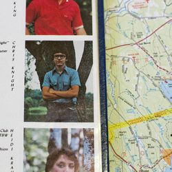 A 1984 yearbook, opened to a page showing Christopher Knight, is displayed on a map prior to a news briefing by the Maine Department of Public Safety, Thursday, April 11, 2013, in Rome, Maine.  Knight lived like a hermit for decades. Known as the North Pond Hermit, Knight was arrested Thursday, April 4, 2013, while stealing food from another camp in Rome. Authorities said he may be responsible for more than 1,000 burglaries. 