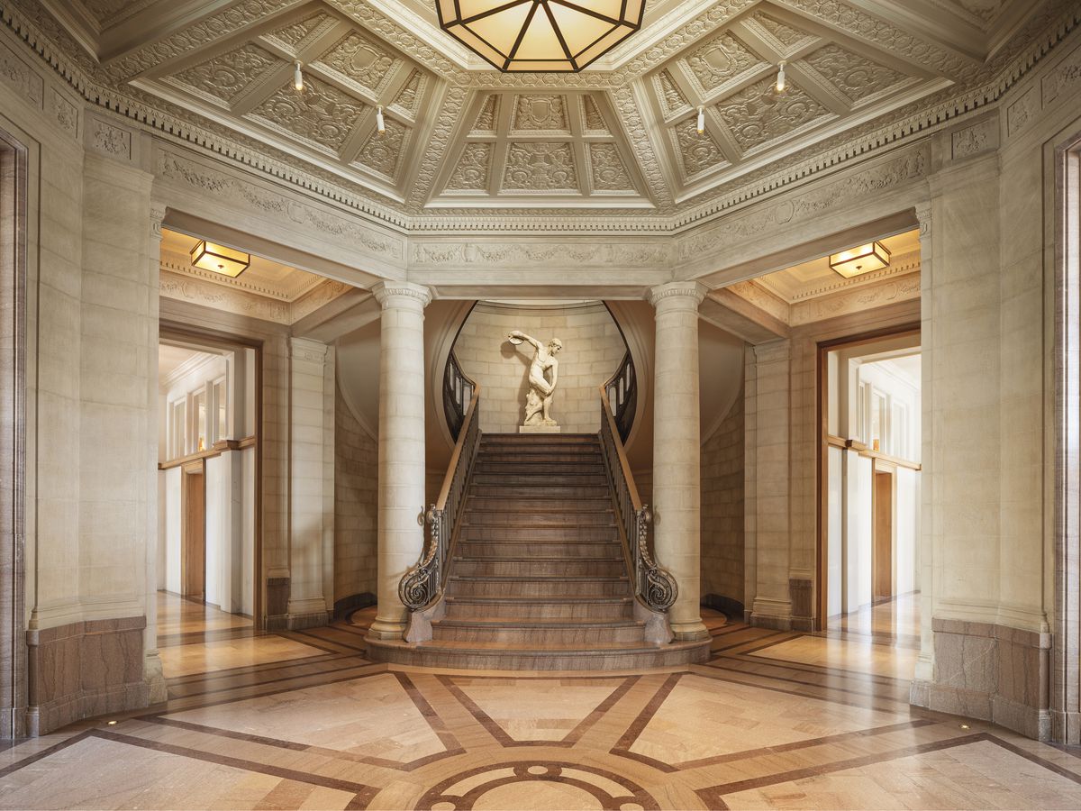 The marble entryway to RH San Francisco including a center stairway. 