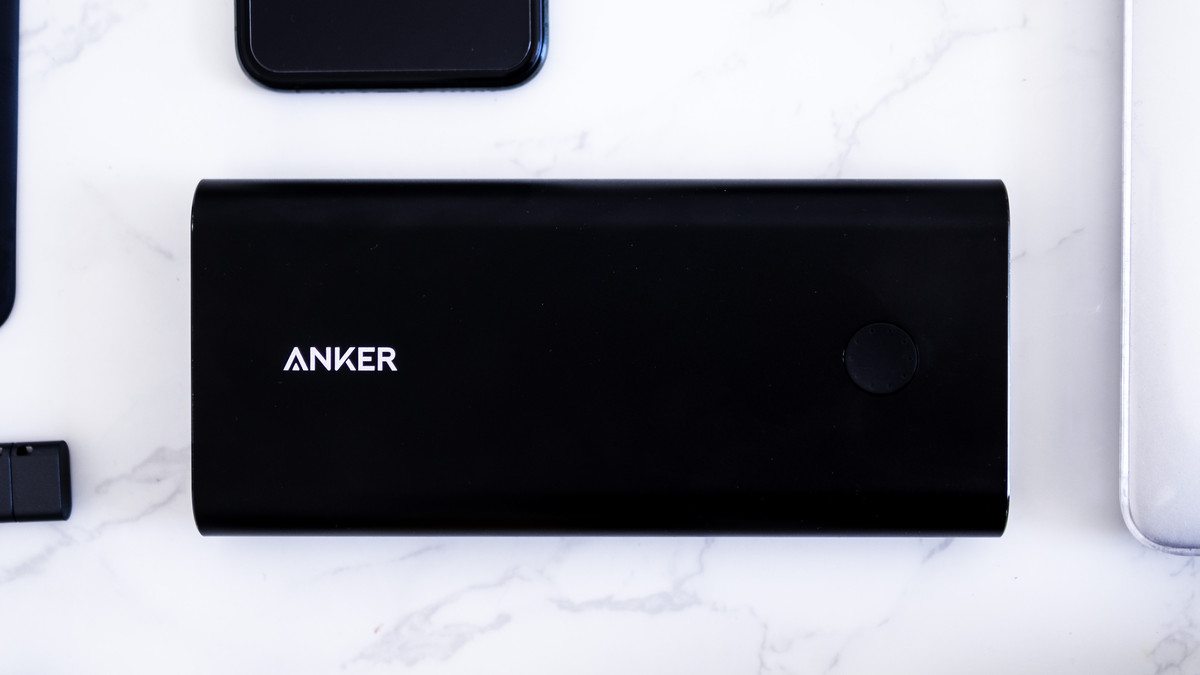 Black Anker Powercore+ 26800 PD laid flat on marble table top