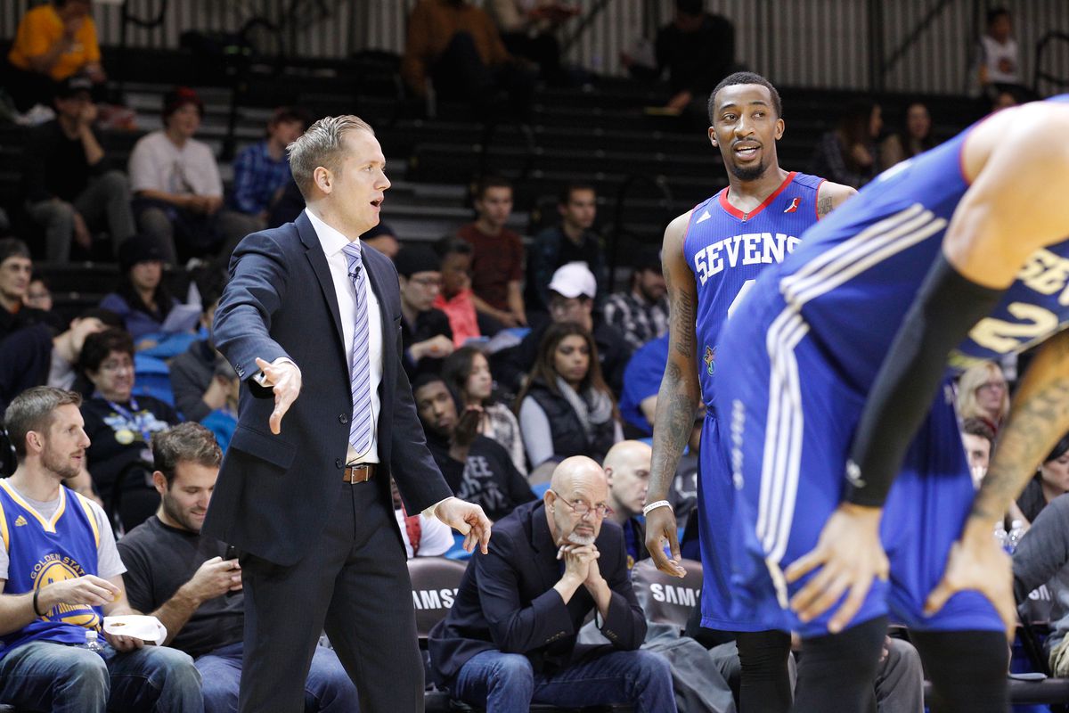 Delaware 87ers' head coach Kevin Young gives instruction to Jordan McRae.