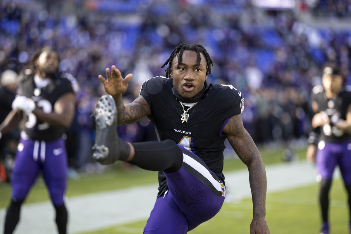 Zay Flowers #4 of the Baltimore Ravens stretches as he warms up prior to an NFL football game between the Baltimore Ravens and the Miami Dolphins at M&amp;T Bank Stadium on December 31, 2023 in Baltimore, Maryland.