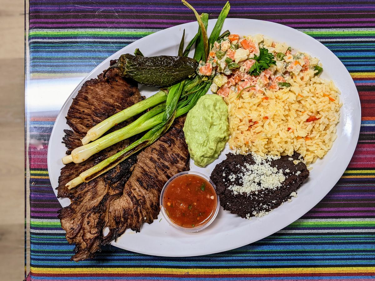 Churrasco with beans and rice.