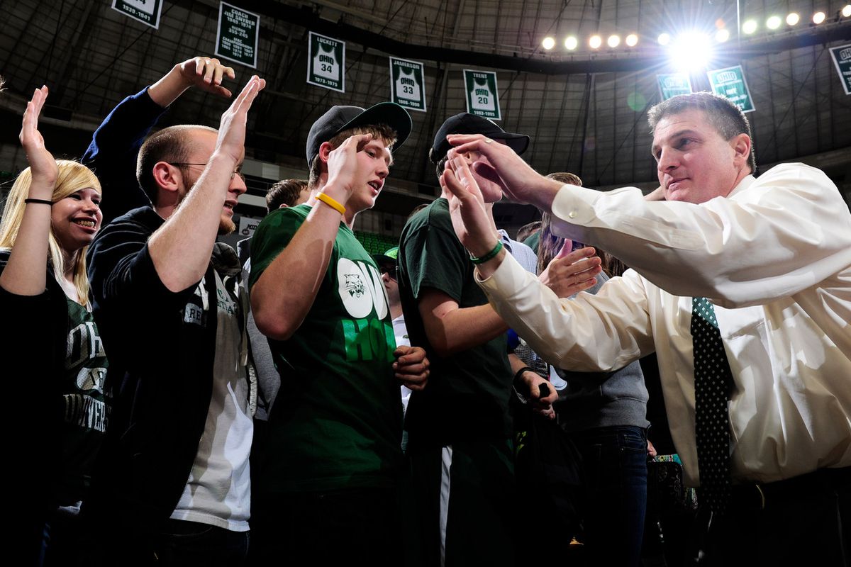 Jim Christian celebrates with the Ohio student section following the Bobcats first-round CIT win over Cleveland State.
