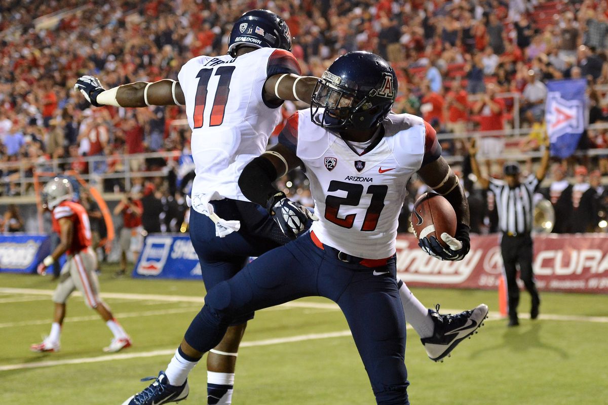 Will Parks celebrates with Tra'Mayne Bondurant after returning an interception for a touchdown against UNLV