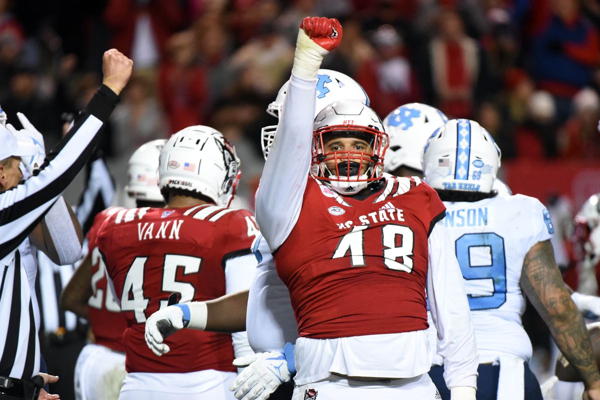North Carolina State Wolfpack defensive tackle Cory Durden gestures at the North Carolina Tar Heels bench after a fourth down stop during the first half at Carter-Finley Stadium.