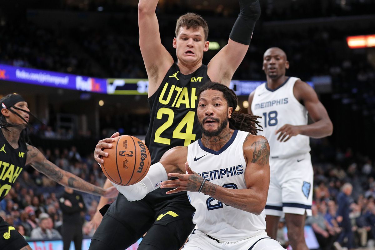 Derrick Rose #23 of the Memphis Grizzlies handles the ball against Walker Kessler #24 of the Utah Jazz during the first half at FedExForum on November 29, 2023 in Memphis, Tennessee.
