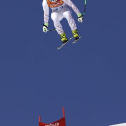 United States' Erik Fisher makes a jump during a men's downhill training run for the Sochi 2014 Winter Olympics, Friday, Feb. 7, 2014, in Krasnaya Polyana, Russia.