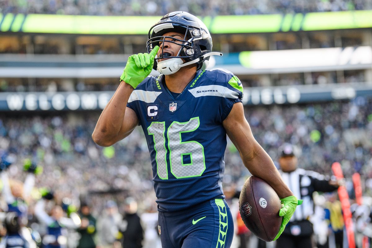 SEATTLE, WASHINGTON - NOVEMBER 27: Tyler Lockett #16 of the Seattle Seahawks celebrates during the first half of the game against the Las Vegas Raiders at Lumen Field on November 27, 2022 in Seattle, Washington.