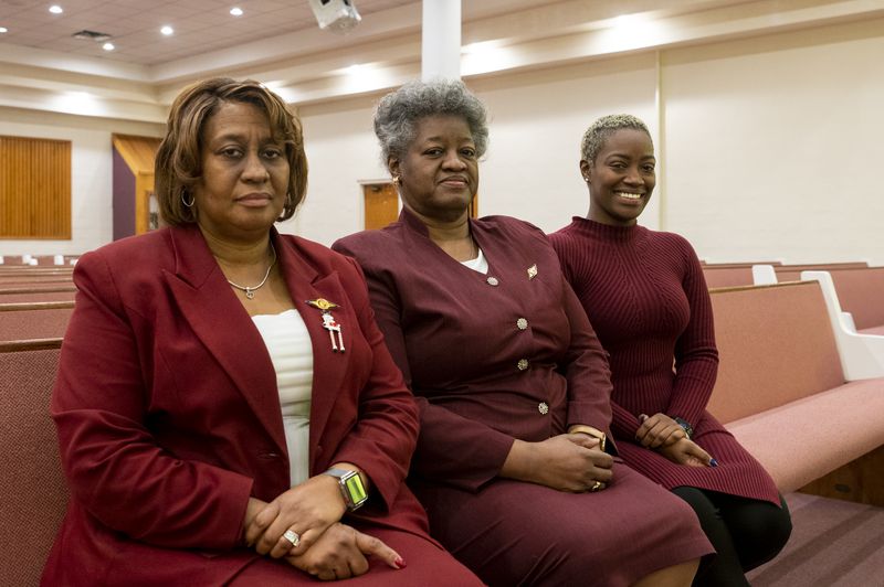The family of Mr. Lafayette Gatling Sr. — daughter Shirl Gatling, wife Marguerite Gatling and daughter Marquita Gatling — gather Wednesday in Gatling’s Chapel, at 10133 S. Halsted Ave., to remember Mr. Gatling. 