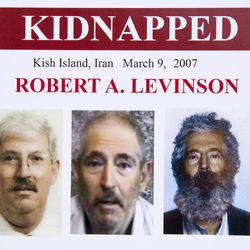 An FBI poster showing a composite image of retired FBI agent Robert Levinson, right, of how he would look like now after five years in captivity, and an image, center, taken from the video, released by his kidnappers, and a picture before he was kidnapped, left, displayed during a news conference in Washington, on March 6, 2012. The FBI announced a reward of up to $1,000,000 for information leading to the safe location, recovery and return of Levinson, who disappeared from Kish Island, Iran, five years ago on March 9, 2007. For years the U.S. has publicly described him as a private citizen who was traveling on private business.