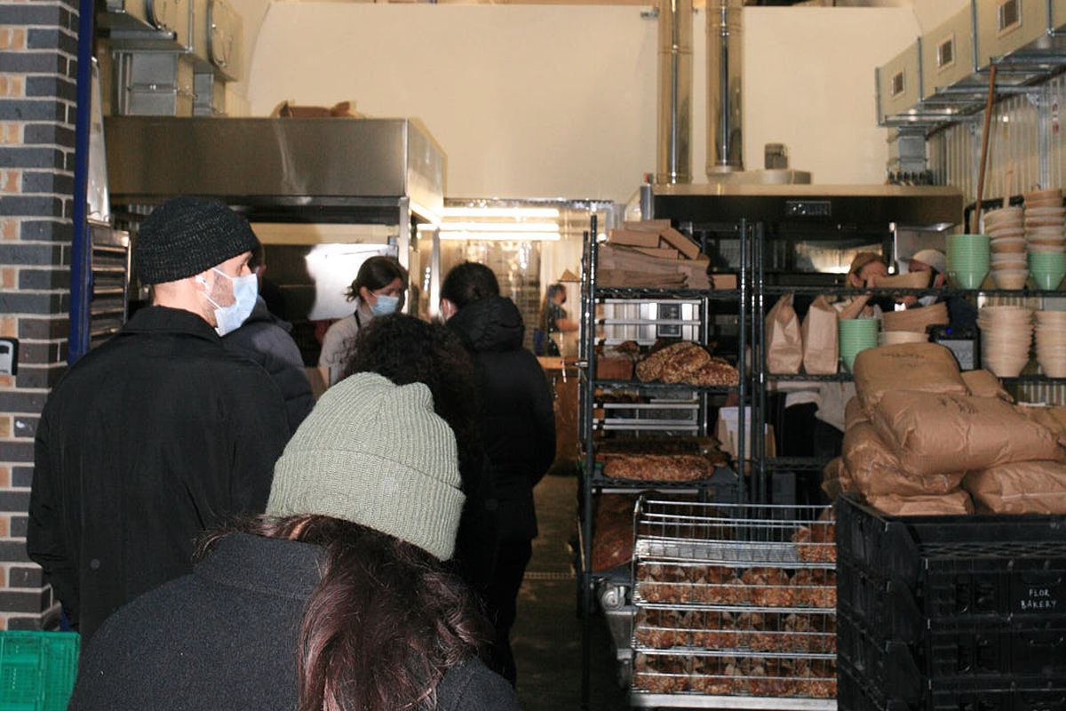 Customers queue up outside Flor Bakery’s Bermondsey arch, with pastries and breads racked up for sale