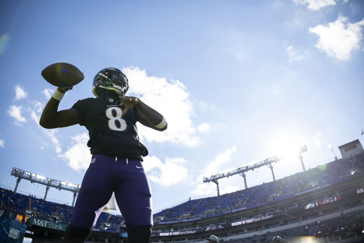 Lamar Jackson #8 of the Baltimore Ravens throws a pass as he warms up prior to an NFL football game between the Baltimore Ravens and the Miami Dolphins at M&amp;T Bank Stadium on December 31, 2023 in Baltimore, Maryland.