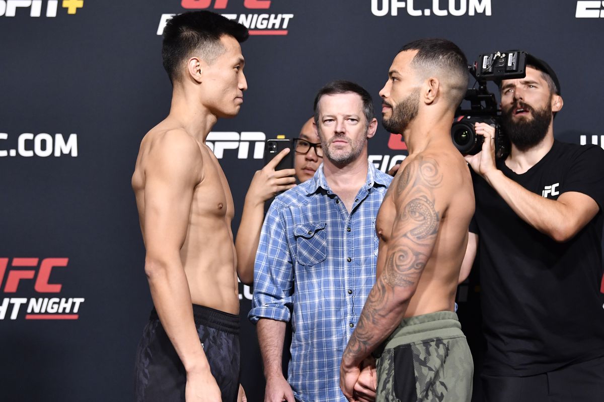 In this UFC handout, opponents ‘The Korean Zombie’ Chan Sung Jung of South Korea and Dan Ige face off during the UFC weigh-in at UFC APEX on June 18, 2021 in Las Vegas, Nevada.