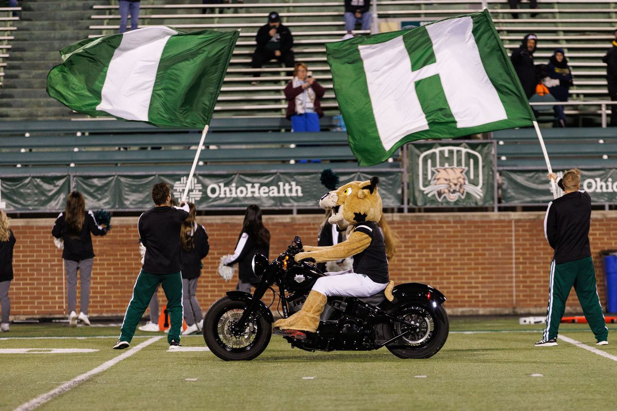 Rufus the Bobcat rides onto the field on a motorcycle before a Mid-American Conference game between the Toledo Rockets and the Ohio Bobcats on November 16, 2021 at Peden Stadium in Athens, Ohio.