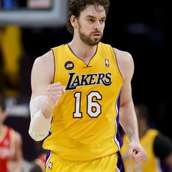 Los Angeles Lakers' Pau Gasol, of Spain, pumps his fist after making a basket against the Houston Rockets during the second of an NBA basketball game in Los Angeles, Wednesday, April 17, 2013. The Lakers won 99-95 in overtime. (AP Photo/Jae C. Hong)