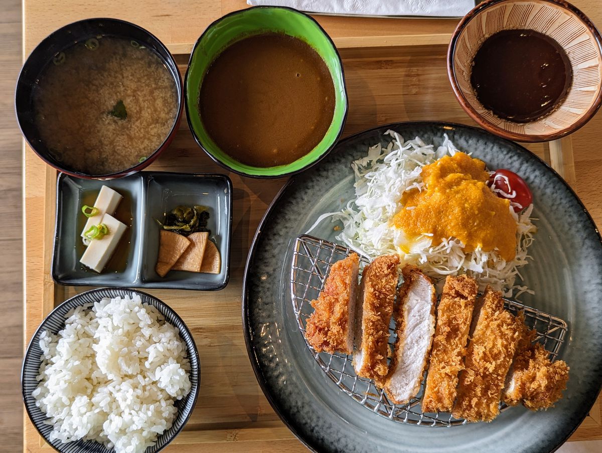 Tonkatsu set with an extra $3 side of curry on a tray.