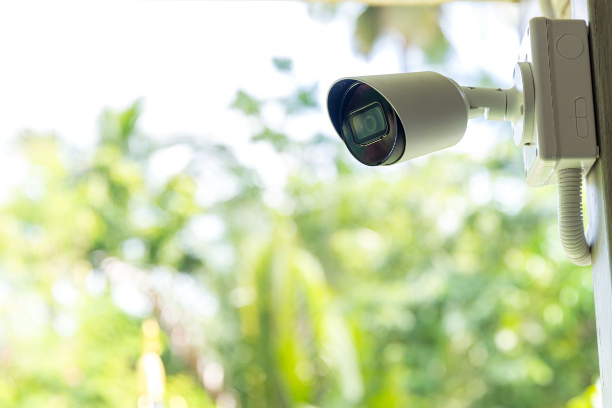 Close-up of a home security camera set up outdoors