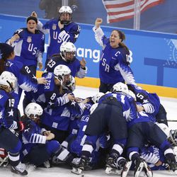 The United States players celebrate after winning the women's gold medal hockey game against Canada at the 2018 Winter Olympics in Gangneung, South Korea, Thursday, Feb. 22, 2018.