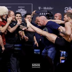 Conor McGregor tries to kick Khabib at UFC 229 weigh-ins.