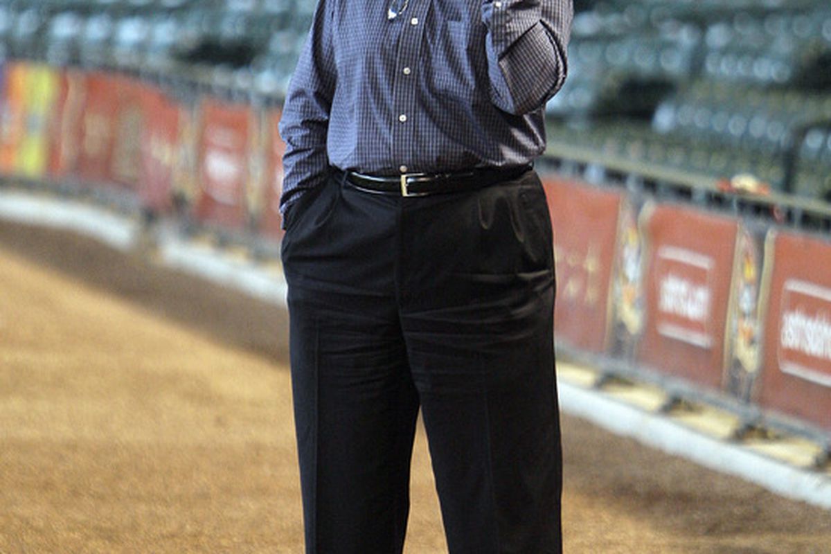 HOUSTON - JULY 23:  Houston Astros general manager Ed Wade talks on the phone during battting practice before the Houston Astros play the Cincinnati Reds at Minute Maid Park on July 23 2010 in Houston Texas.  (Photo by Bob Levey/Getty Images)