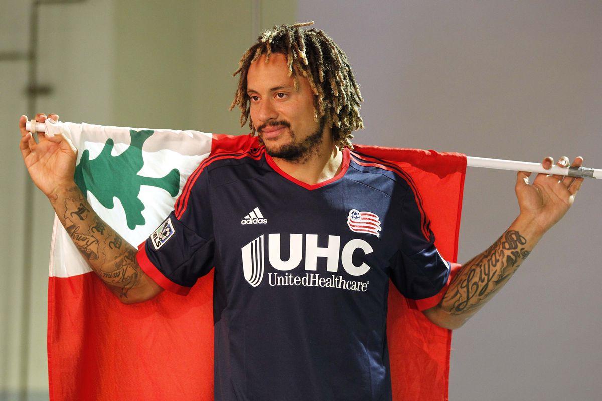 Will He or Won't He? Jermaine Jones poses with a flag of some sorts
