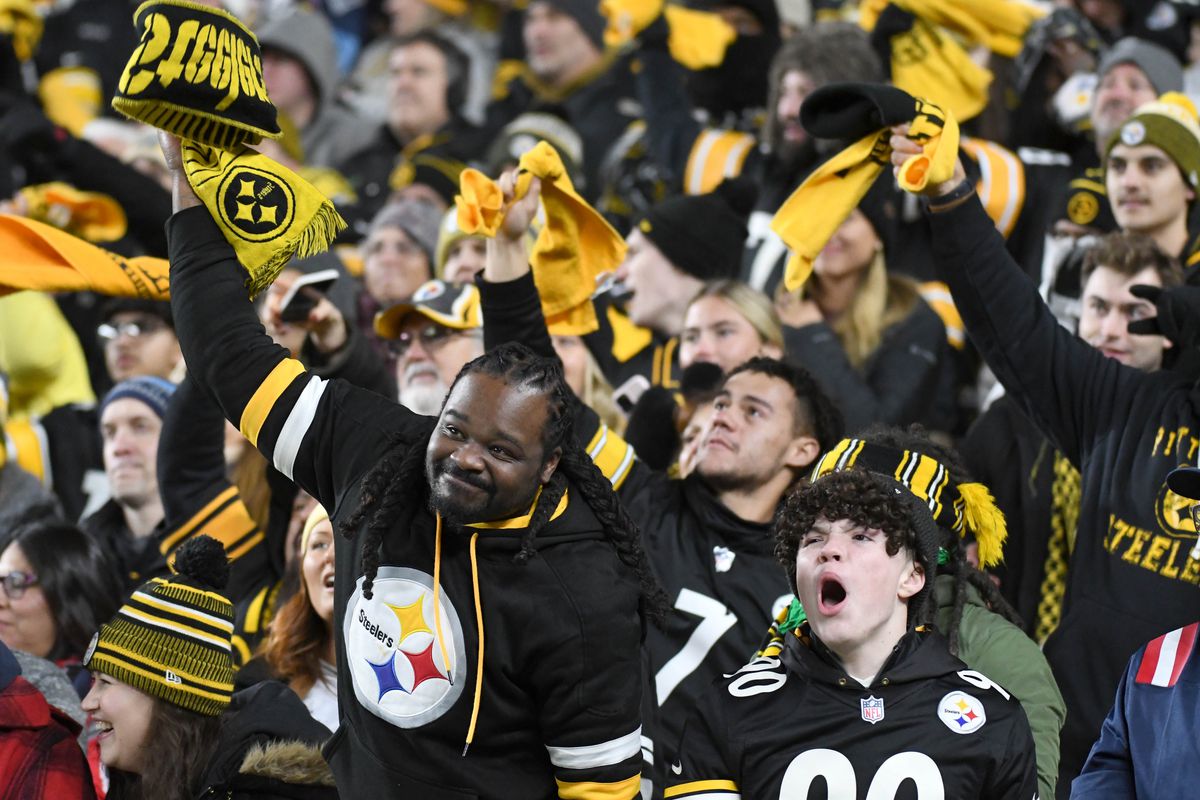 Pittsburgh Steelers fans cheer on the home team in a game against the New England Patriots during the fourth quarter at Acrisure Stadium.&nbsp;
