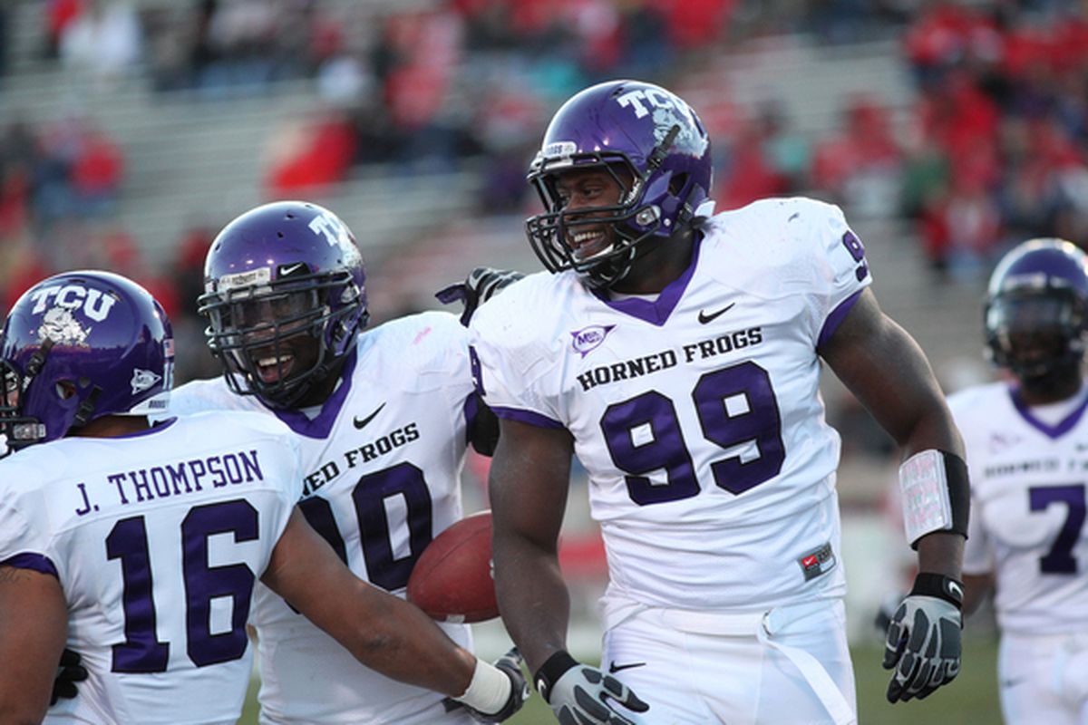 ALBUQUERQUE NM - NOVEMBER 27: Braylon Broughton #99 Stansly Maponga #90 (C) and Jurell Thompson #16 of the TCU Horned Frogs.(Photo by Eric Draper/Getty Images)