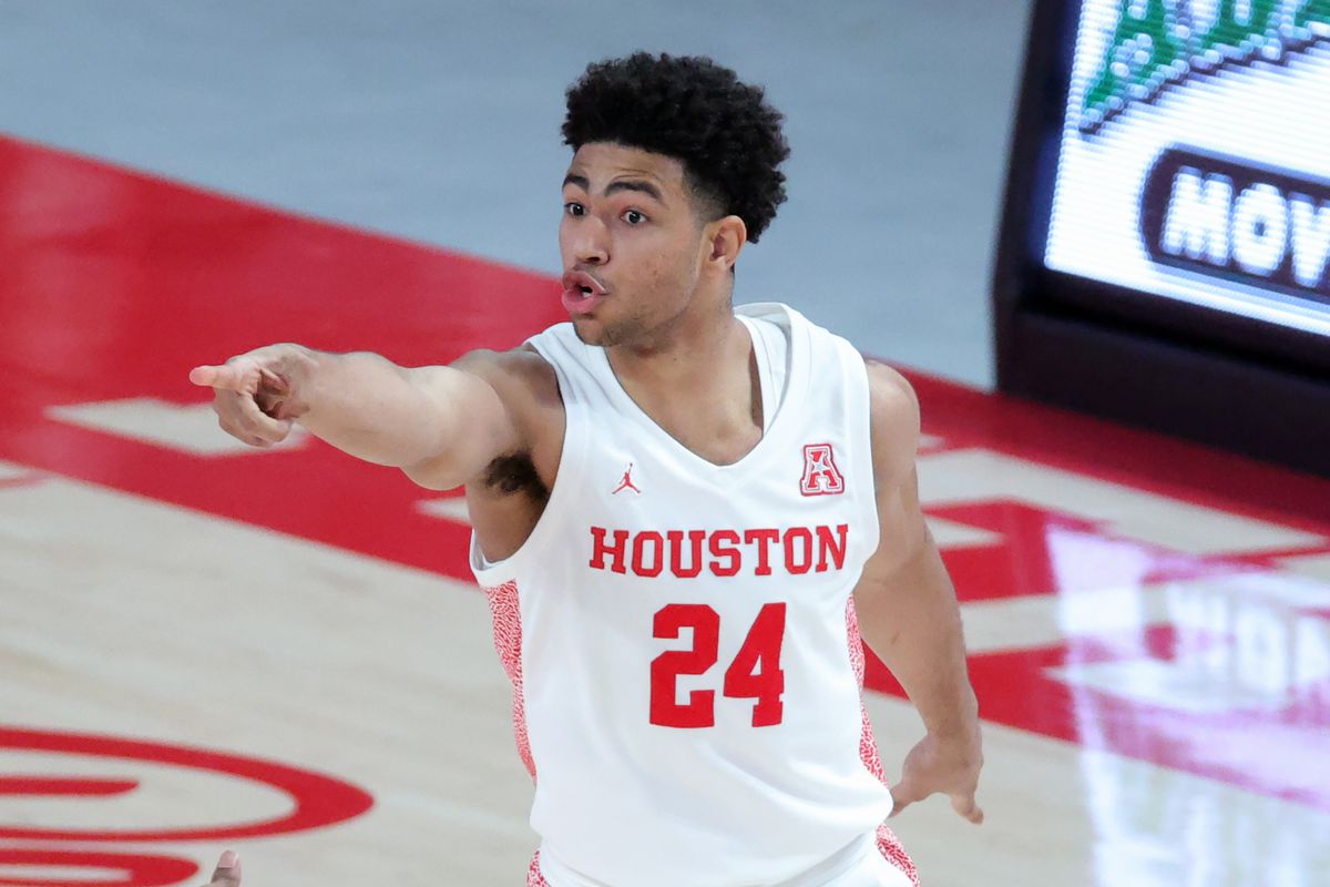 Quentin Grimes of the Houston Cougars reacts after a basket during the first half of a game against the Cincinnati Bearcats at the Fertitta Center on February 21, 2021 in Houston, Texas.