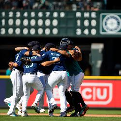 Aug 25, 2022; Seattle, Washington, USA; The Seattle Mariners infield including Seattle Mariners second baseman Adam Frazier (26) and relief pitcher Andres Munoz (75) huddle to dance in a circle as they celebrate beating the Cleveland Guardians at T-Mobile Park. The Mariners beat the Guardians 3-1. Mandatory Credit: Lindsey Wasson