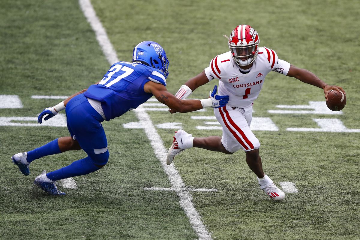Levi Lewis of the Louisiana-Lafayette Ragin Cajuns scrambles and avoids the tackle of Victor Heyward of the Georgia State Panthers in the second half at Center Parc Stadium on September 19, 2020 in Atlanta, Georgia.