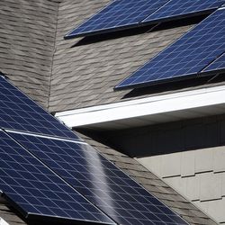 Nick Mason's solar panels are seen on his home where roughly 80 percent of his electrical bill is paid for by solar energy in Provo, Friday, Oct. 7, 2016. Clean energy advocates will be affected by the recent vote by Provo leaders to assess a net metering fee on municipal power customers.