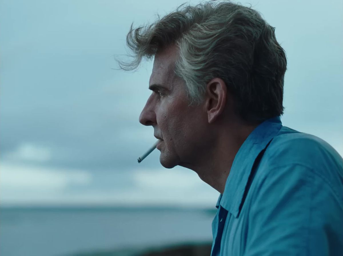 Bradley Cooper as Leonard Bernstein smoking a cigarette in Maestro