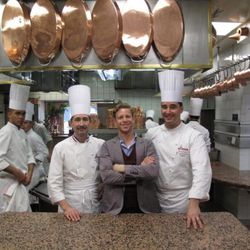 The chef, Christian Bouvard, JDS and sous chef Olivier Cousin in the kitchen of Restaurant Paul Bocuse. 