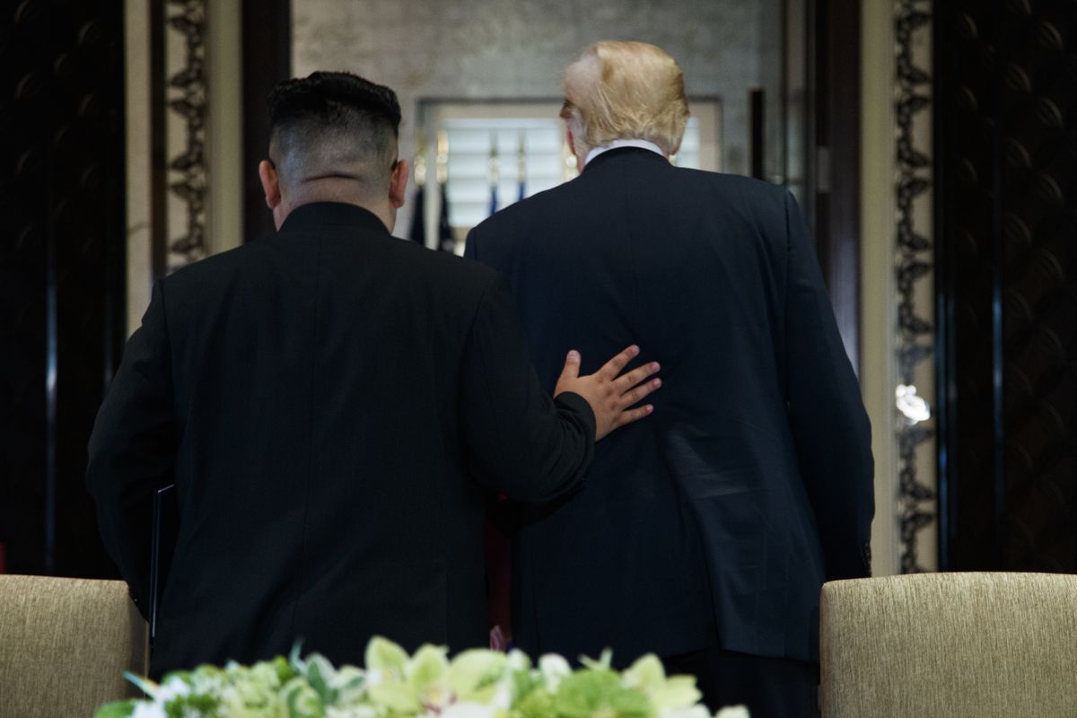 President Donald Trump and North Korean leader Kim Jong Un walk off after a signing ceremony that capped off their historic summit on Singapore’s Sentosa island, Tuesday, June 12, 2018.