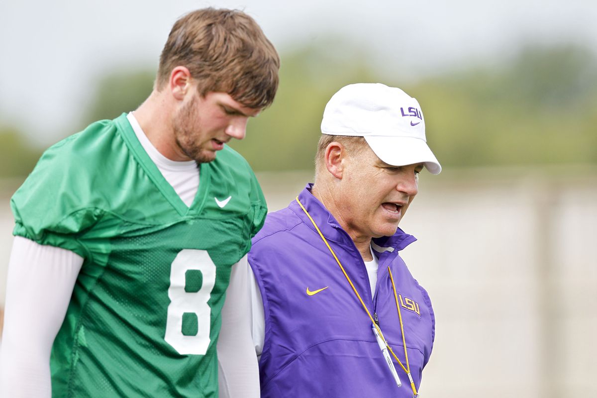 August 2, 2012; Baton Rouge, LA, USA;  LSU Tigers head coach Les Miles talks with quarterback Zach Mettenberger (8) during the fall camp practice at the Charles McClendon Practice Facility.  Mandatory Credit: Derick E. Hingle-US PRESSWIRE