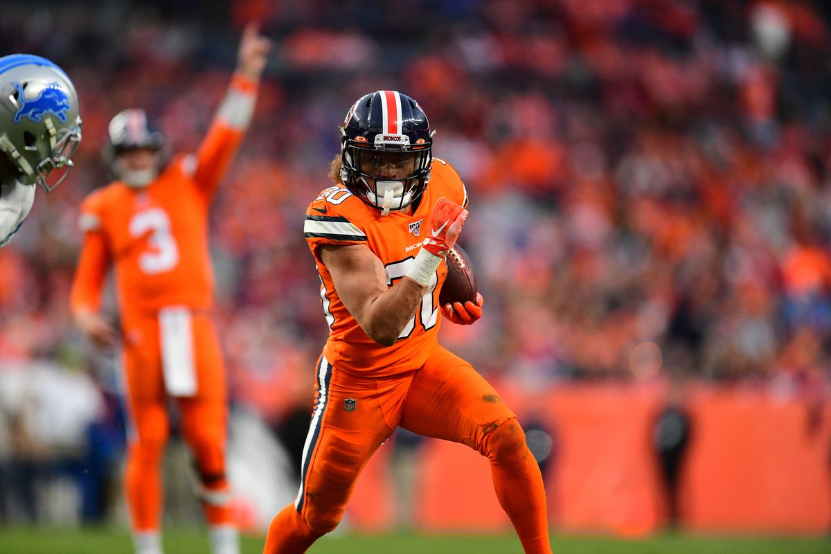 Denver Broncos running back Phillip Lindsay carries the ball against the Detroit Lions in the fourth quarter at Empower Field at Mile High.