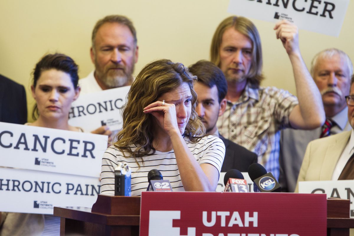 FILE - Desiree Hennessy cries during her speech about her son suffering during a press conference held by the supporters and legislators of the Utah Patients Coalition 2018 medical cannabis initiative campaign at Utah State Capitol Building in Salt Lake C